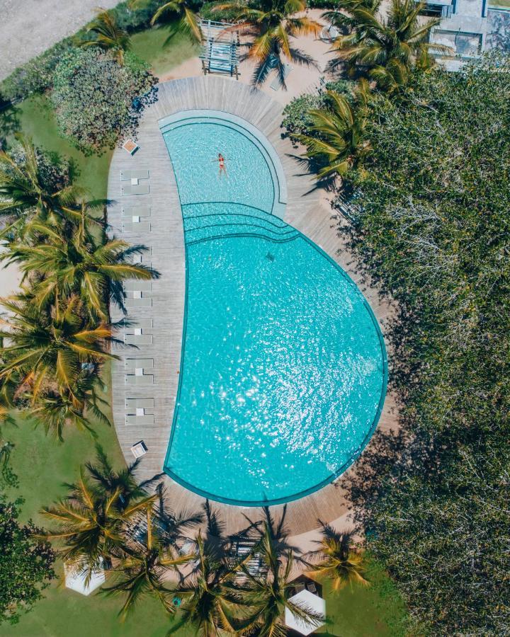 Lux* Grand Gaube Resort & Villas Exteriör bild Aerial view of the pool at the 2019 World Championships